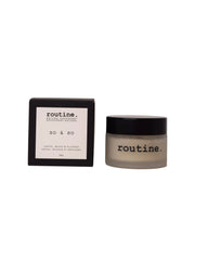A jar of routine. So & So natural deodorant next to its black packaging box on a light gray background.