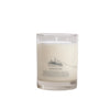 Candle in a glass jar with a label on a light gray background